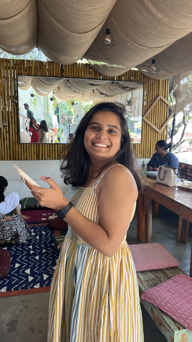 A woman smiling at a Harsham gathering